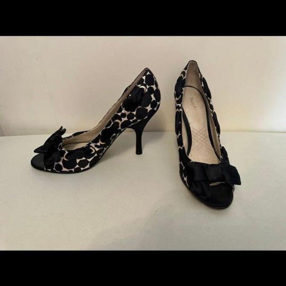 Enzo Angiolini high heels with black and white design, bow, and peep toe